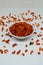 Savory and crunchy spicy macaroni in a bowl on a white background.