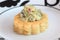 Savory filled pastry case or vol-au-vent on dinner plate