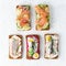 Savory fish smorrebrod, set of five traditional Danish sandwiches. Black rye bread with anchovy, beetroot, radish, eggs, salmon,