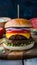 Savory grilled beef burger topped with cheese, tomato, and onion
