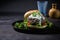 Savory Lamb Burger with Yogurt Sauce on Black Ceramic Plate generative AI