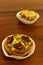 Savory mini quiches tarts on a wooden board. Baked homemade flaky dough pies. Ready for eat. Copy space