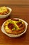 Savory mini quiches tarts on a wooden board. Baked homemade flaky dough pies. Ready for eat. Copy space