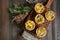 Savory mini quiches tarts on a wooden board. Flaky dough pies.