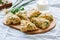 Savory scones with feta mozzarella and green herbs on a wooden b