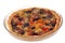 Savory tart tomatoes and black olives in a dish close-up on white background