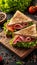 Savory triangle sandwich filled with ham, cheese, tomato, and accompanied by a fresh salad