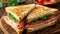 Savory triangle sandwich with layers of fresh ham, cheese, and tomato salad on the side