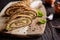 Savory whole wheat roulade stuffed with Tofu cheese, onion, garlic and herbs