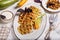 Savory zucchini waffles with herbs served with sour cream sauce
