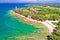 Savudrija lighthouse and turquoise crystal clear rocky beach aerial view