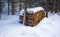 Sawn trees covered with snow in the forest in winter