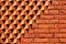 Sawtooth pattern brickwork. Decorative red brick wall as background