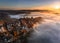 Saxon, Germany - Aerial panoramic view of the Bastei on a foggy autumn morning with colorful autumn foliage and heavy fog