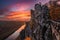 Saxon, Germany - Beautiful rock formation of the Bastei bridge with spectacular colorful autumn sunset above Elbe river