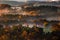 Saxon, Germany - Warm foggy autumn sunrise above the valley in Saxon Switzerland National Park