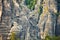 Saxon Switzerland national park. tiny climber on the rock, Germany