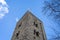 The Saxon Tower in Cornmarket Street against a blue sky in Oxford, Oxfordshire, UK