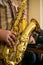 Saxophone jazz music instrument Tenor sax saxophonist hands Closeup player