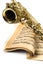 Saxophone On Music Notes Book Close-up