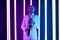 Saxophone player in a white suit against the backdrop of neon lamps with blue backlight. Saxophonist jazzman with sax