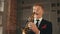 Saxophonist in dinner jacket play on golden saxophone at stage. Jazz vocalist