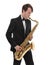 Saxophonist in a tuxedo plays music on sax.