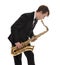 Saxophonist in a tuxedo plays music on sax.