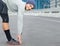 Say limber, stay quick. Portrait of a young male jogger stretchng in the street before a run.