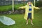 Saying thanks to the sky. Shot of a cheerful little boy standing with an umbrella while opening his mouth to catch rain