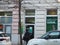 Sberbank. A depositor or client stands in front of the entrance to the branch of a subsidiary of Sberbank of Russia