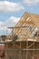 Scaffold platform and roof trusses on new building under construction