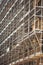 a scaffolding construction pattern against a building in Italy. construction site street symbolizes progress, urban growth