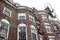 Scaffolding on the face of an old brownstone building, urban renovation