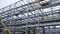 Scaffolding installation at a tank with process structures of refinery petrochemical plants in the background. Large