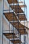 scaffolding made of metal profile and wooden decking along the building during the renovation. Restoration of an old building in