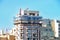 Scaffolding surrounds the top two stories of an apartment block in Sliema in Malta