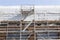 Scaffolding under blue sky on new housing facility in the nether