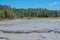 Scalding water flowing in a thermal desert at Upper Geyser Basin in Yellowstone National Park, Wyoming