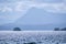 Scale.  Small islet in Johnstone Strait and mountain, Vancouver Island