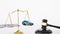 The scales of justice and the judge hammer with the money placed on the board also have a white background.