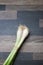 Scallions on a gray kitchen counter top