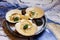 Scallops on blue plate with lemon