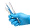 Scalpel in the hands of doctor in gloves on white background. Surgeon with knife before surgery
