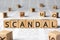 Scandal - word wooden blocks with letters