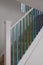 Scandi design staircase with blue, turquoise and green ombre painted stair spindles.