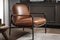 scandinavian armchair with sleek leather and metal details