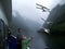 Scandinavian boy feeding seagulls from a cruise ship