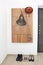 Scandinavian design wooden oak hanger piano interior with brown ladies hat, handbag and shoes of dad, mom and girl