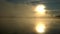 Scandinavian golden sun rises over foggy lake and forest, reflection in water and mysterious play of foggy air - relaxation and